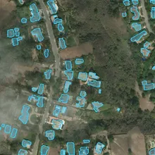 Detected building footprints outlined on the pre-event image.