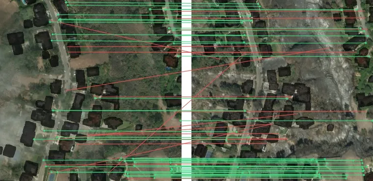 SIFT matches between the pre- and post-fire images with building footprints masked out (dark): consistent matches on roads and open ground.